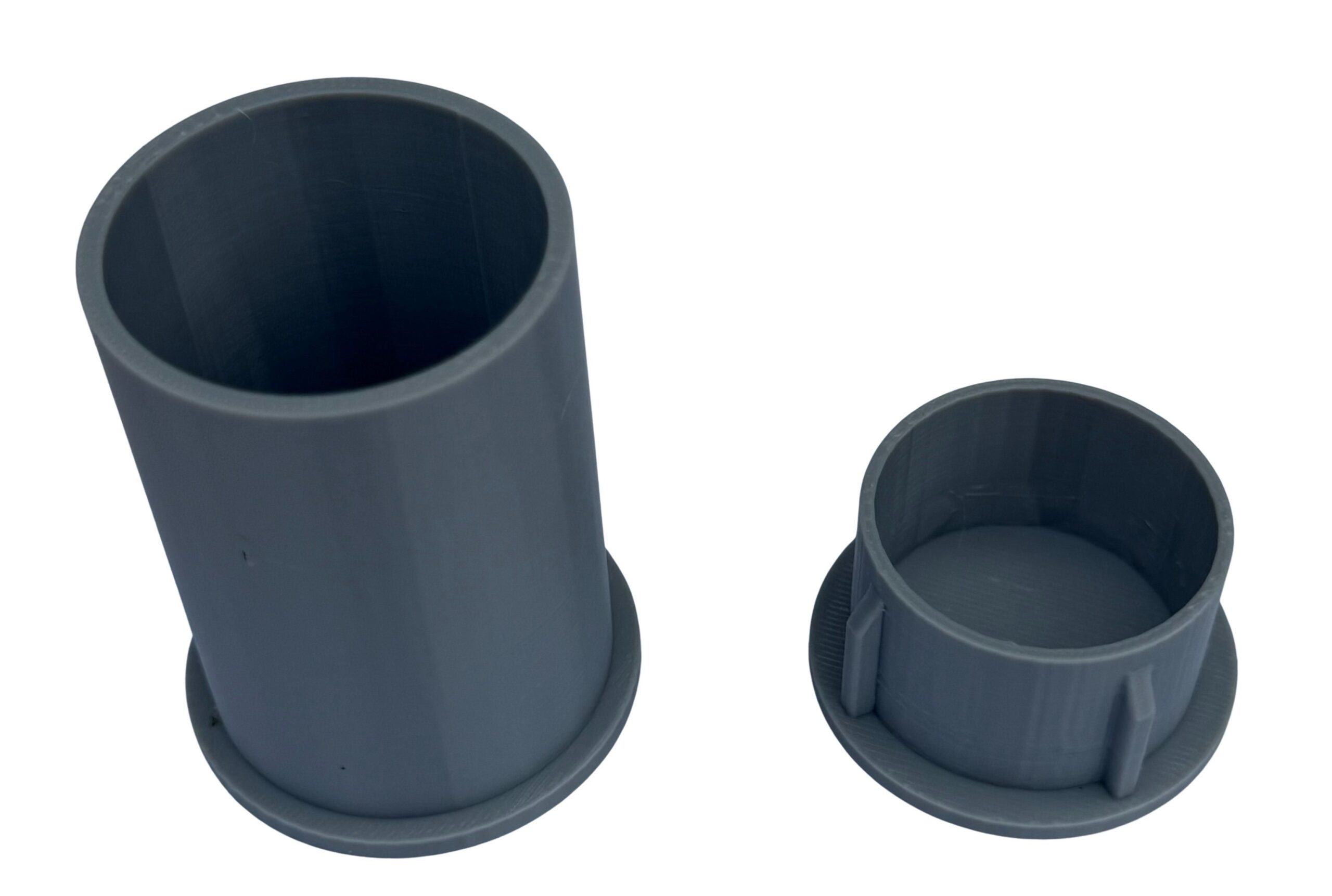 Grey 3D-printed replacement parts on a white background